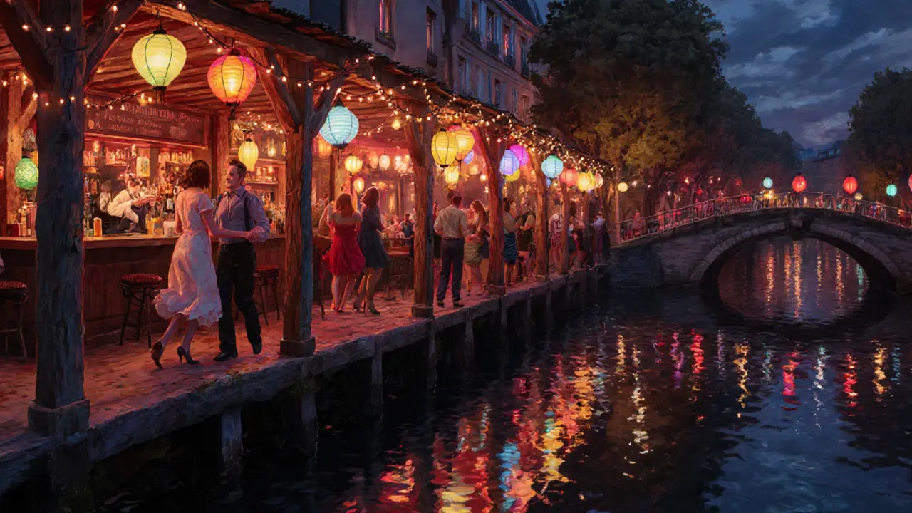 Nighttime canal scene with lantern-lit bar reflected in water.