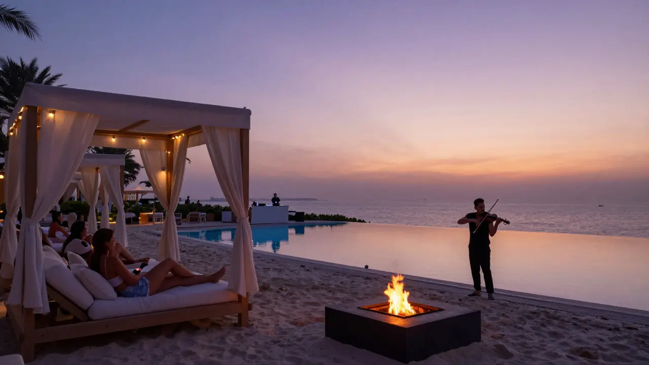 Beach club at dusk with cabanas, pool, and fire pit under soft twilight lighting.